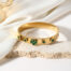 Green bangle in gold